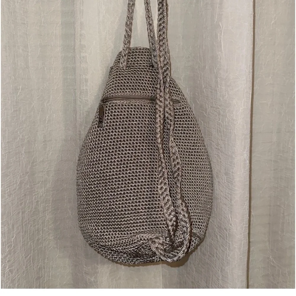 The Sak sling Backpack in the color mushroom